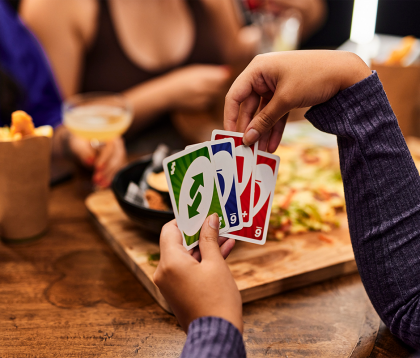 Group of people playing uno in the Tavern